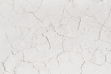 White cracked background texture, light background with dark scratch, the ground near the chalk quarry, copy space