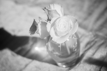 Black and white photo of roses in a Simon Pearce vase.