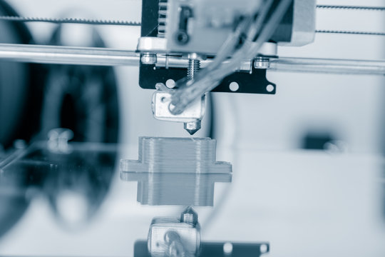 Electronic three dimensional plastic printer during work , 3D printer.