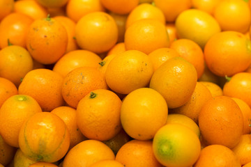 Bunch of fresh mandarin oranges on market. Fruit texture