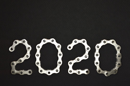 bike chain year 2020 lower section on dark background
