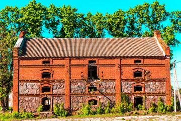Old abandoned building, red brick facade
