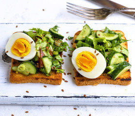 toasted square pieces of bread from white wheat flour with boiled egg