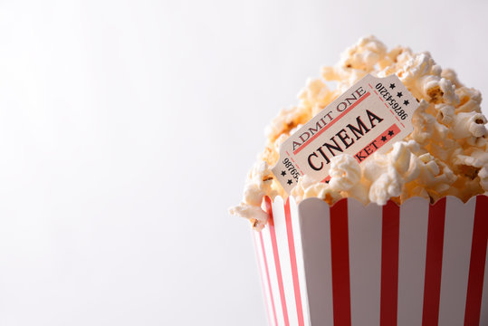 Popcorn And Movie Tickets On White Background Top View