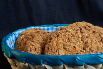 Savory cookies sprinkled with sesame seeds, sunflower on shale board