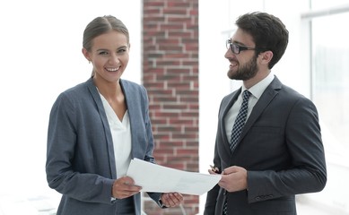 colleagues discussing business documents