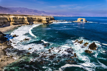 La Portada a rock formation like a door on the Pacific Ocean to enter inside chilean territory at Atacama Desert, Chile