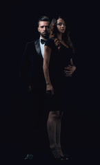 Fototapeta na wymiar elegant man and woman posing next to each other on studio.