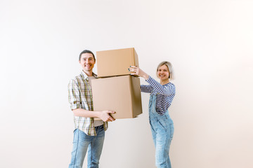 Image of young man and woman with cardboard box