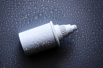 Filter cartridge on a black background