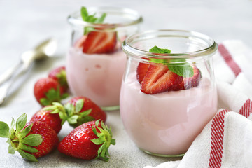 Natural strawberry yogurt with fresh berry and mint. - obrazy, fototapety, plakaty