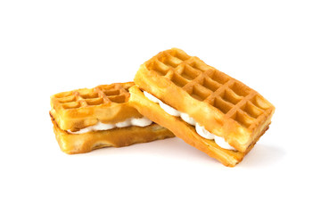 Soft waffles with a filling. Two waffles with a cream filling on a white background.