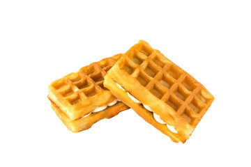Soft waffles with a filling. Two waffles with a cream filling on a white background.