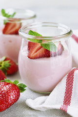 Natural strawberry yogurt with fresh berry and mint.