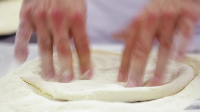 Close up, chef works dough