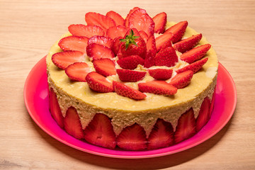 homemade strawberry cake in a red dish