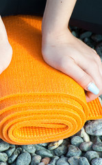 Vertical view of female is finishing her training at the morning on the rocks