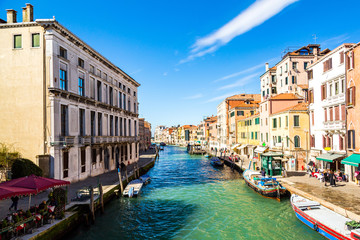 Venice, Italy. Beautiful Venice narrow canals, with many classic gondolas, amazing old rusty...