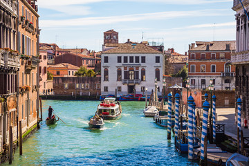 Venice, Italy. Beautiful Venice narrow canals, with many classic gondolas, amazing old rusty...