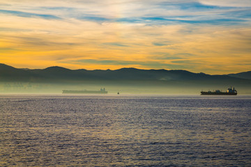 Amazing panoramic view on the rock of Gibraltar during sunset and the ships around it.