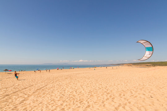 Beautiful ocean view from above on surfers going for the beach. Early morning ocean view in Portugal.