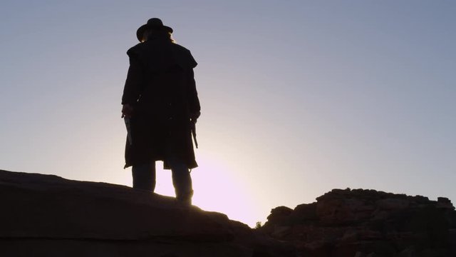 Cowboy Silhouette with pistols in hands