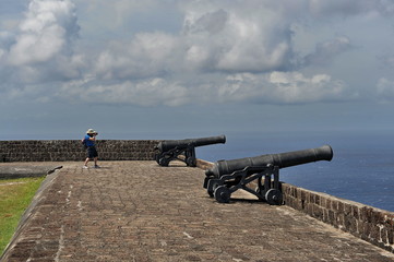 Fototapeta na wymiar Old fortress. Cast Iron Guns on the Fortress Walls