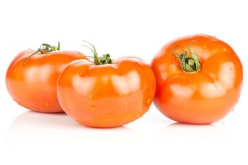 Three red tomato set with vine ends isolated on white background fresh whole.