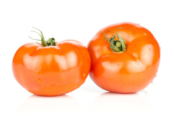 Two red tomato with vine ends isolated on white background fresh whole.
