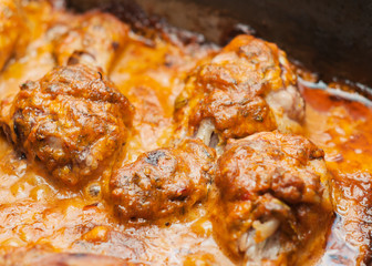 Fried meat, in a frying pan