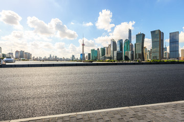 urban asphalt road and modern commercial buildings in shanghai