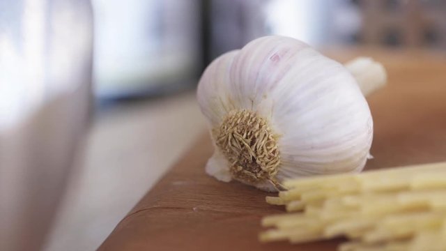 Close up, spaghetti and garlic on counter