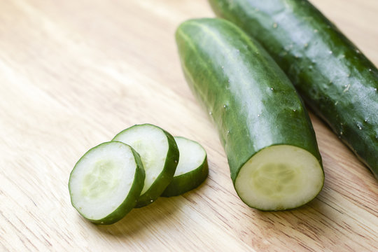 Fresh Cucumber slices on wood background
