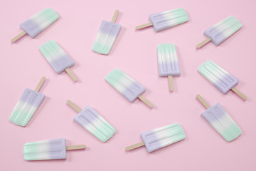 Fruit popsicles, ice cream on pink background