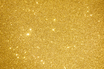 Golden glitter background texture abstract light design with christmas and happy new year holiday sparkle yellow light