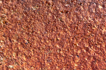 texture of wall covered with rogh plaster and painted in red and yellow color