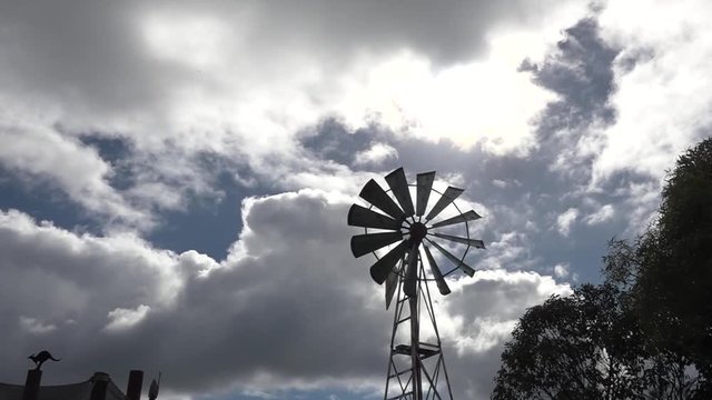 Multi-bladed wind pump in a remote farm in the Outback of Queensland, Australia.