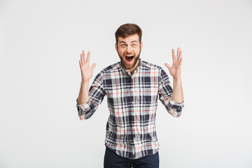 Portrait of an excited young man celebrating success