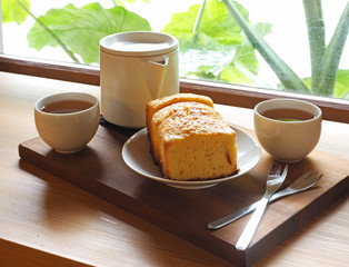Sliced delicious pound cake with hot tea for breakfast