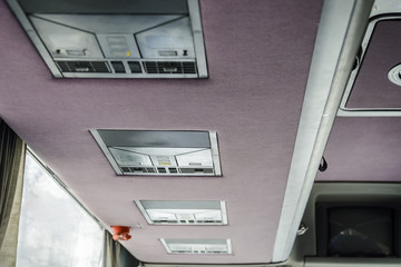 Air conditioning and light panel in a traveling bus.