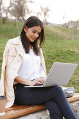 Attractive young woman using laptop computer