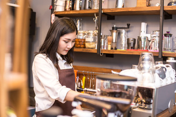 Barista female working at cafe. Working woman small business owner or sme concept.