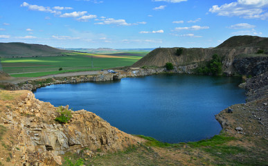 Iacobdeal lake ,formed in a collapsed mine gallery, near Macin mountains, Tulcea county, Romania