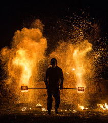 Fiery show with sparks, at a short shutter speed with additional light.