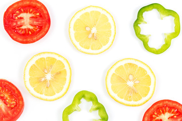 Fototapeta na wymiar lemon slice with tomato and sweet pepper isolated on white background
