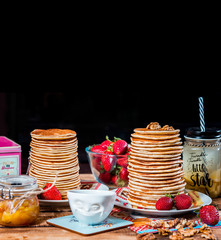 Pancakes with strawberry,walnut and caramel for a breakfast.