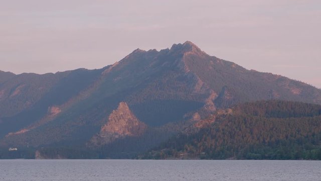 Sunset with mountains by lake in Kazakhstan