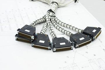 A bundle of cable harnesses lies on the table.