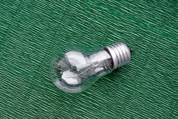 Light bulb on green background. Minimal concept. Copy space