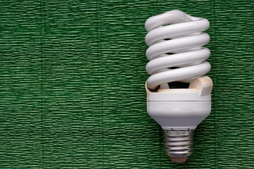 Light bulb on green background. Minimal concept. Copy space